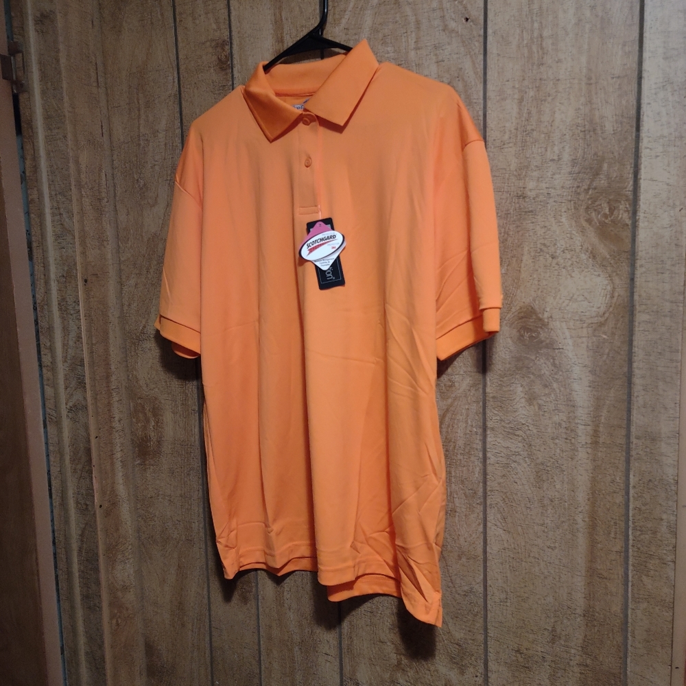 BRAND NEW "BLUE GENERATION" LADIES POLO TOP. SIZE XL. COLOR ORANGE.